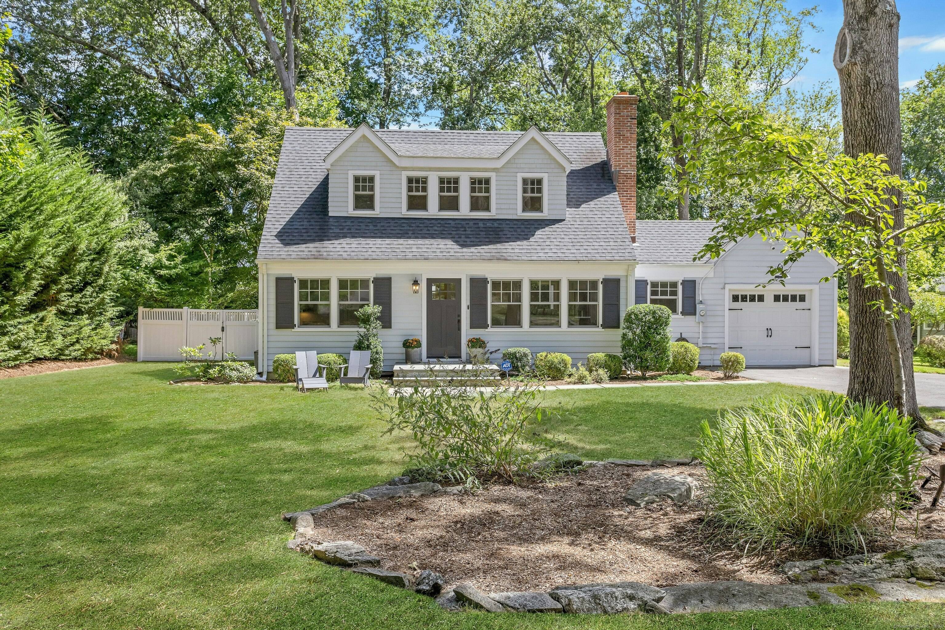 Pristine cape on a quiet street in charming Rowayton.