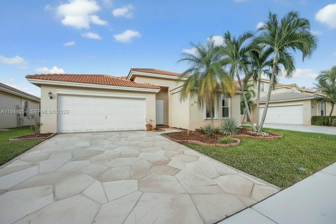Located in the sought after, guard gated community of The Cove at Poinciana Parc, this 3 bedroom, 2.