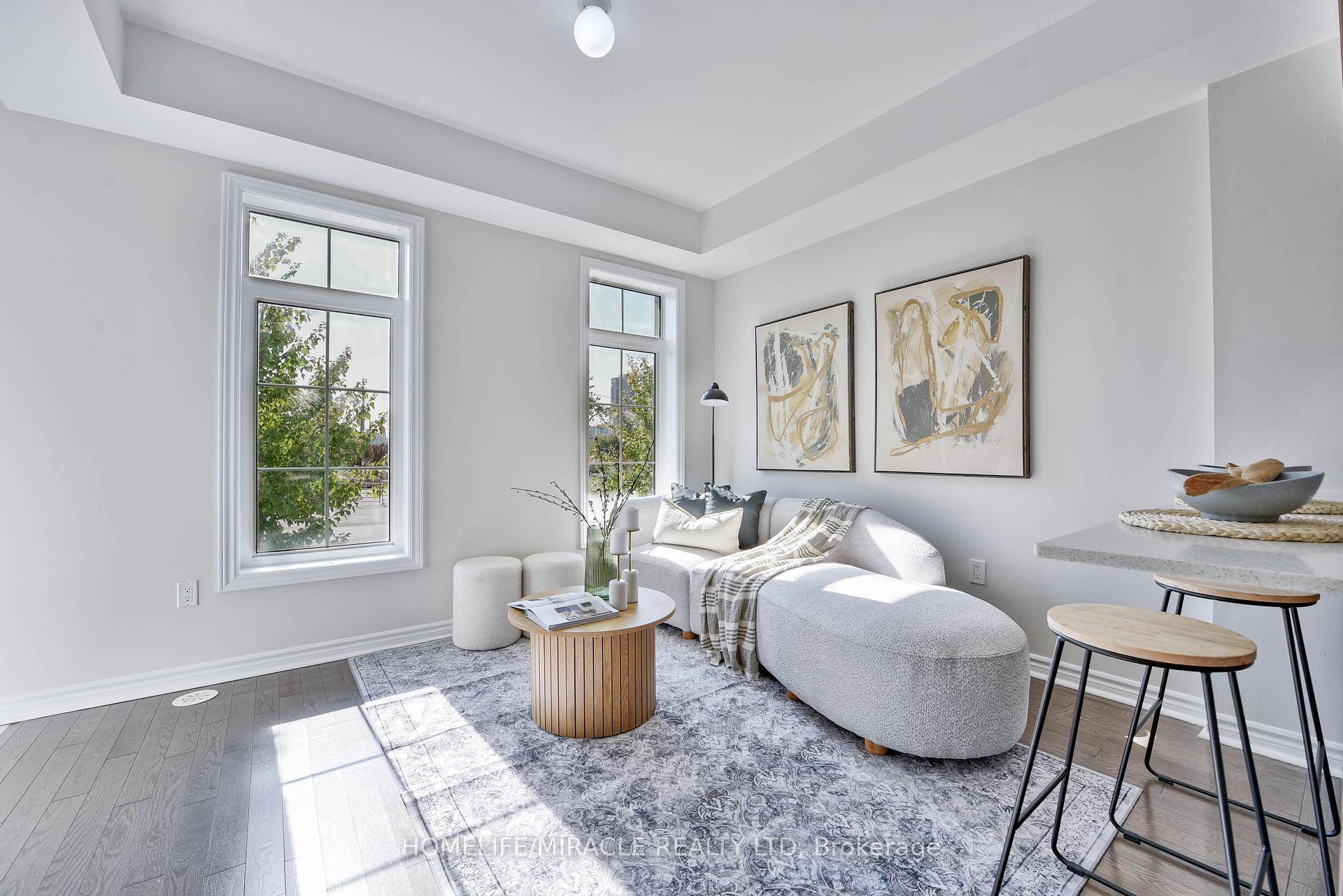 Very Low Maintenance Fee Welcome to this nearly 5 year old, Beautiful freshly painted, sun soaked stacked townhouse with no carpet, offering 2 bedrooms, 1.