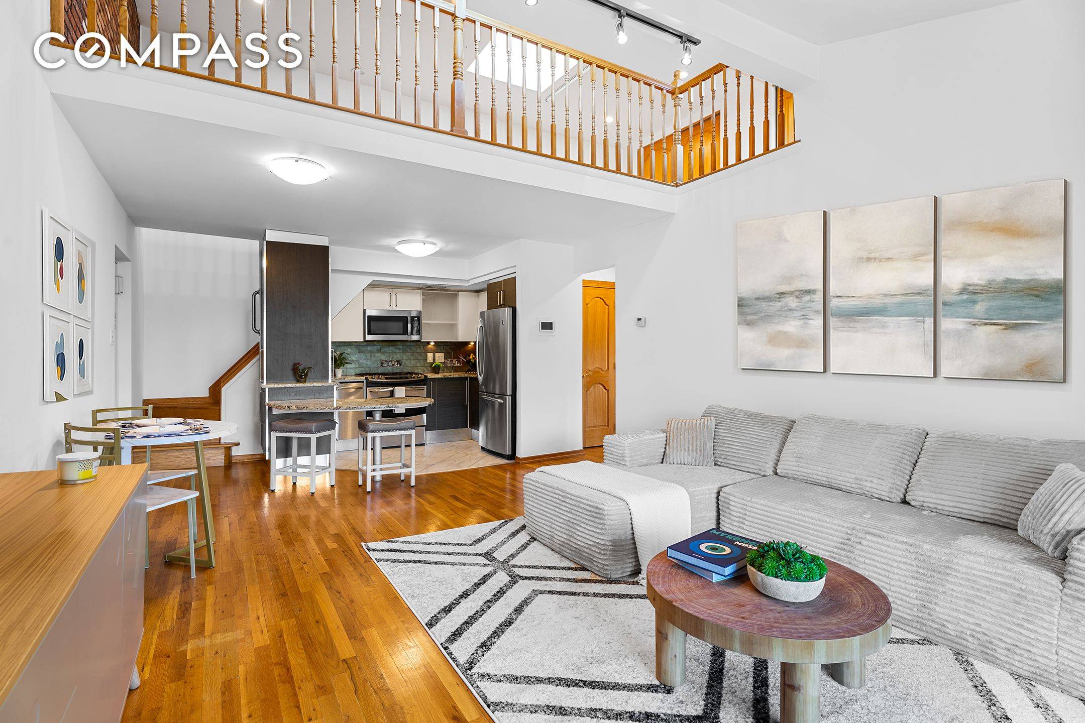Perched atop a quiet, boutique 15 unit condominium, this duplex is all about light, openness, and privacy.