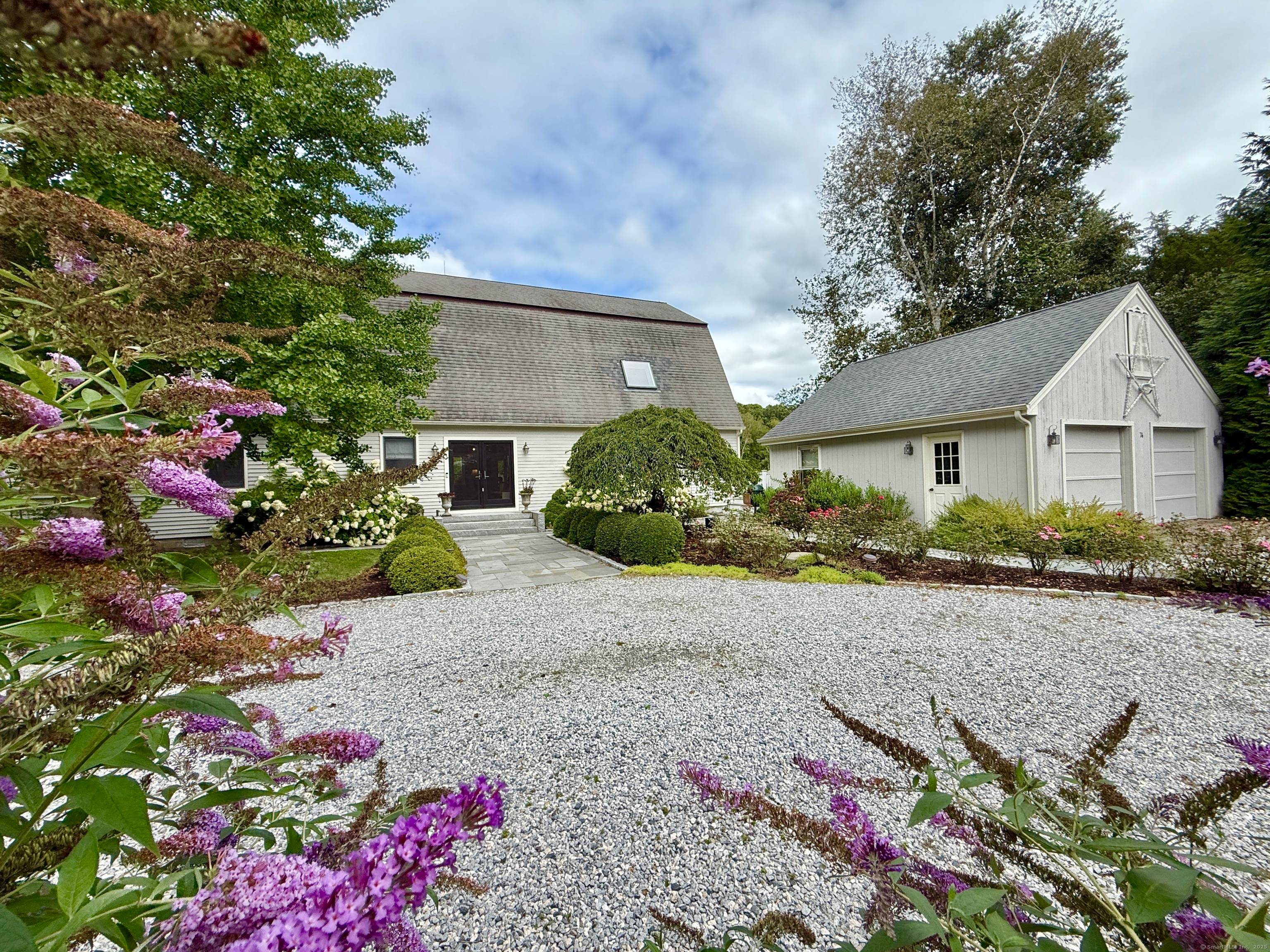 Rich architectural details, modern amenities and water views create a captivating atmosphere in this 1910 renovated barn.