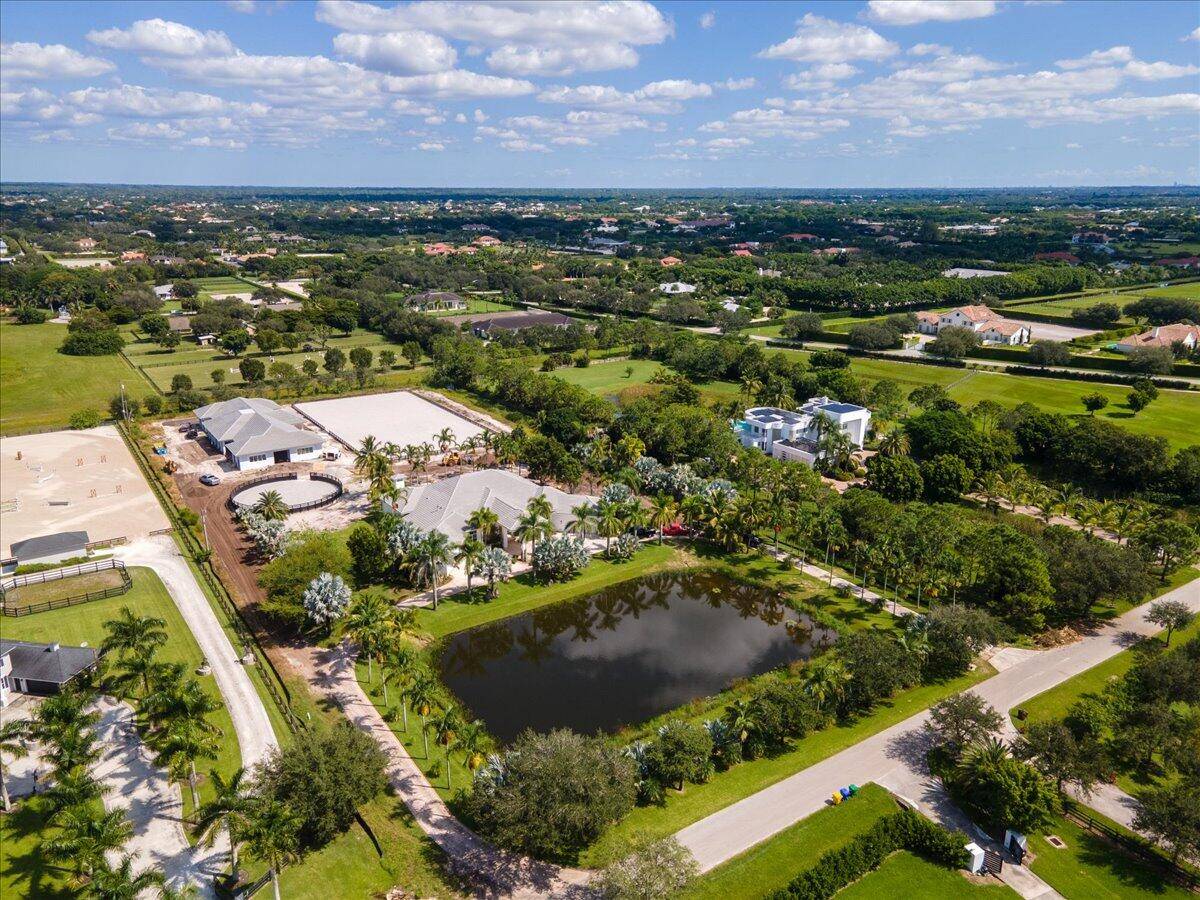 Brand new 12 stall barn with 2 bedroom groom's apartments, 2 tack rooms, 2 groom stalls, 2 washing stalls, an office, all weather ring, round pen and 5 paddocks.