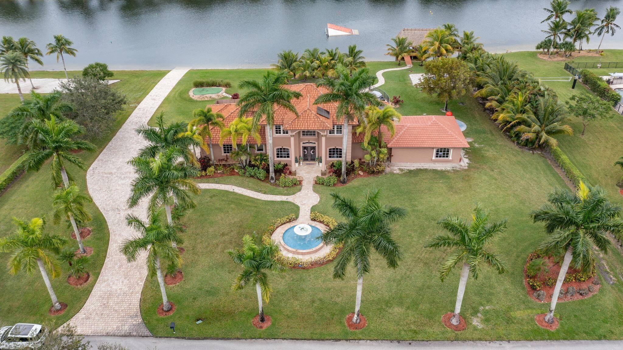 Motivated Seller ! Welcome home to a luxury living at its finest in this rarely available 2 story water ski front and infinity pool home nestled in the highly privately ...