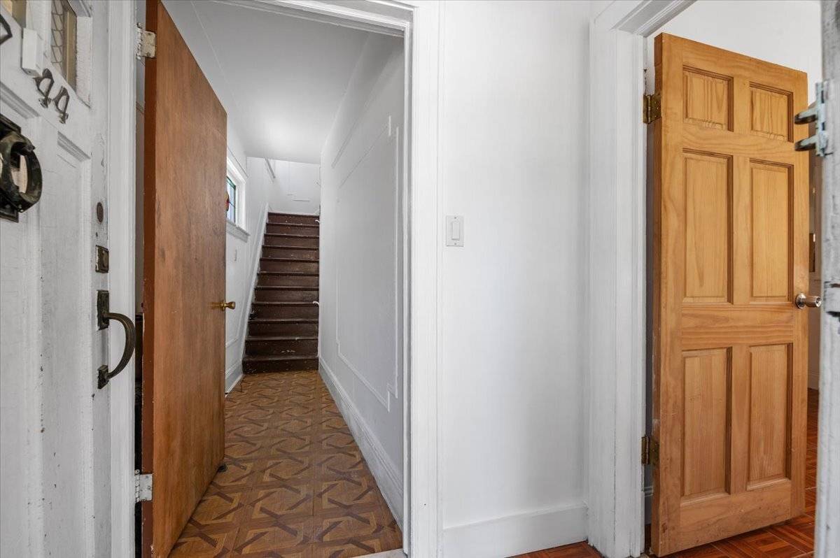 Legal two family detached home with private driveway and detached garage, offered in as is condition.