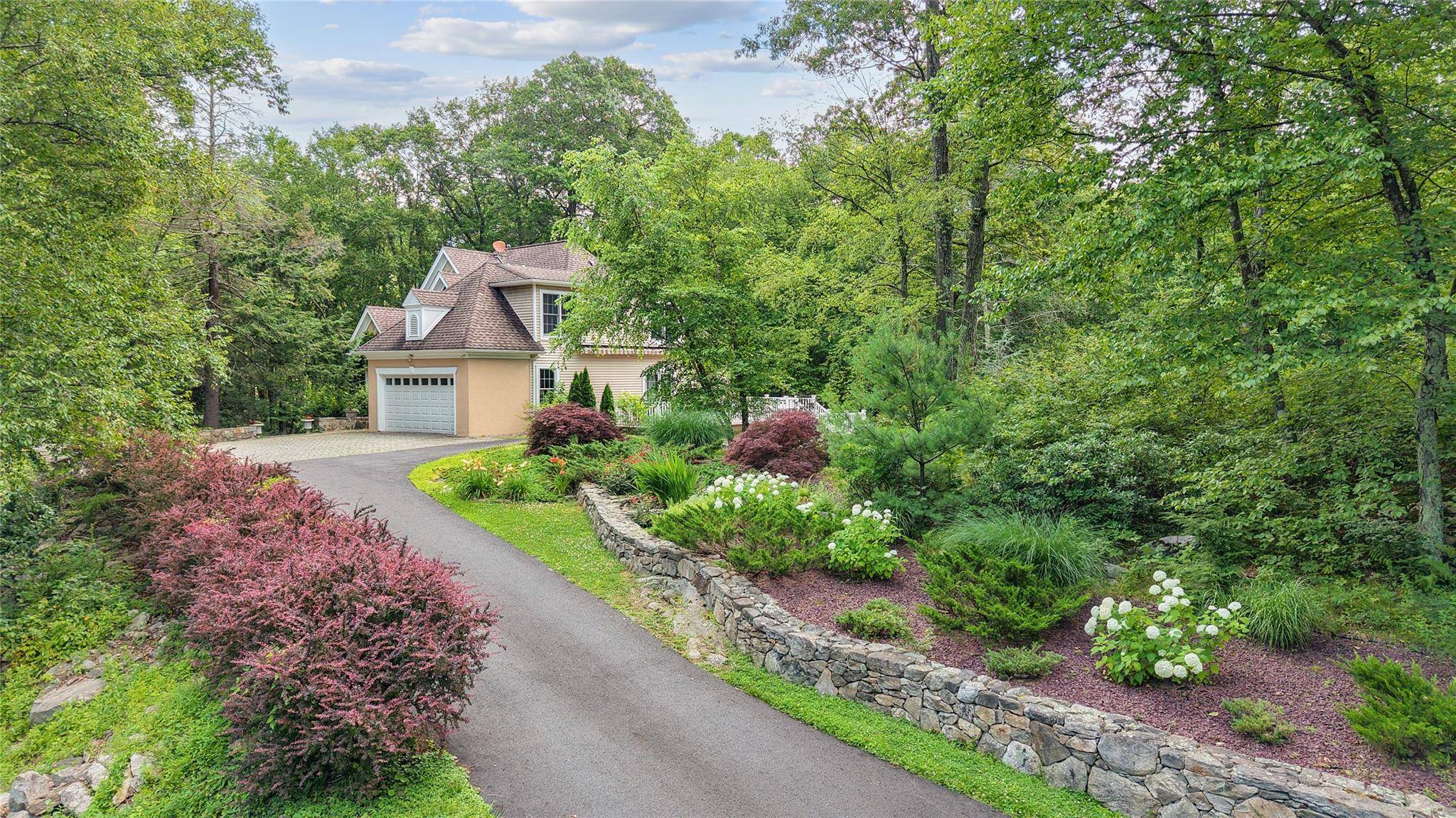 Discover the perfect blend of country charm and convenience in this custom built home, just 8 miles from Cold Spring trains to NYC.