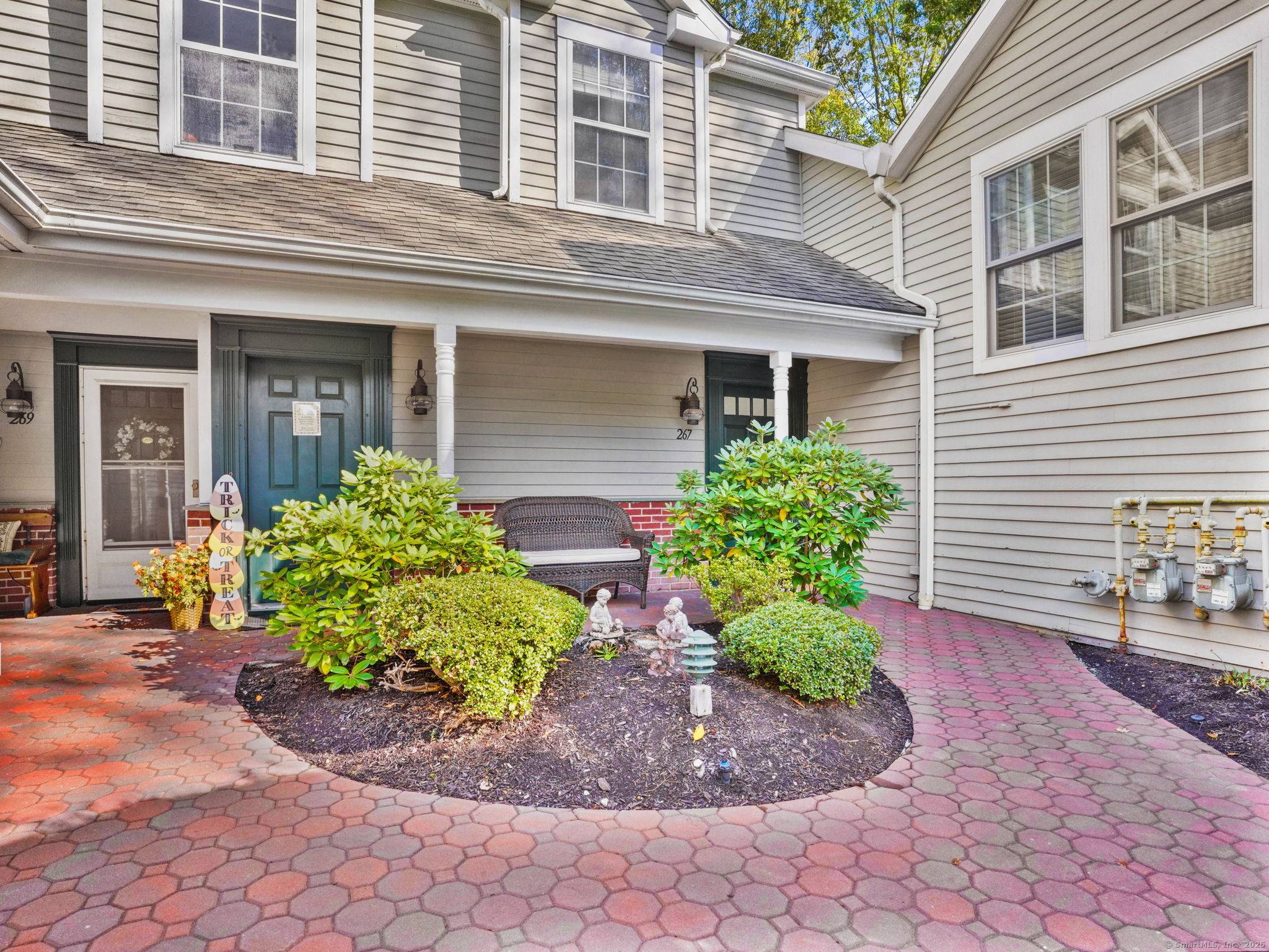 Welcome to 267 Mayfield Drive, a spacious and bright end unit in desirable Trumbull Town Commons.