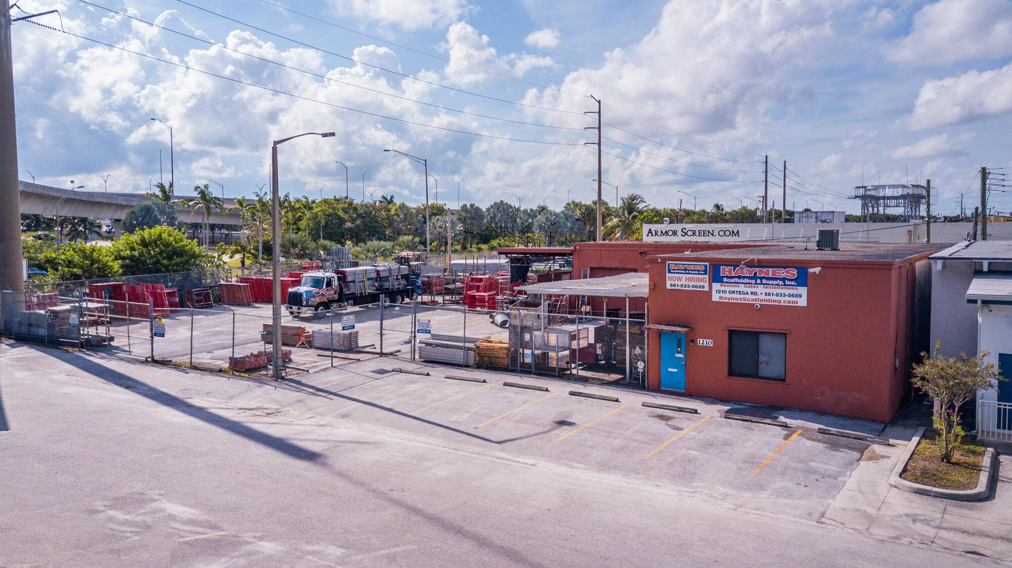 Commercial building, zoned Industrial, offers 3200 sq ft of warehouse and office space with fenced storage parking.