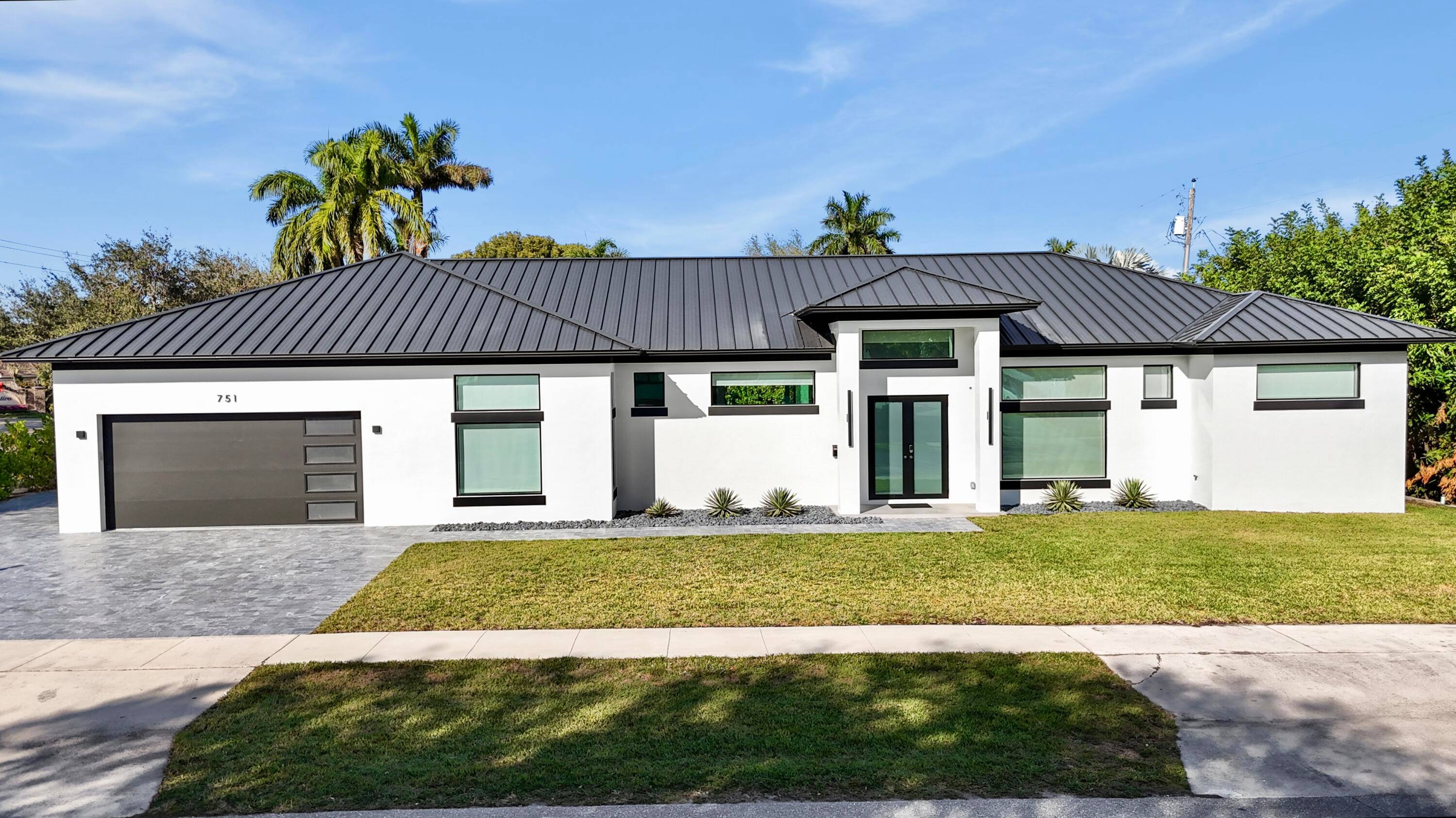 Move In Ready New Construction Custom Pool Home minutes from the waterways of North Palm Beach.