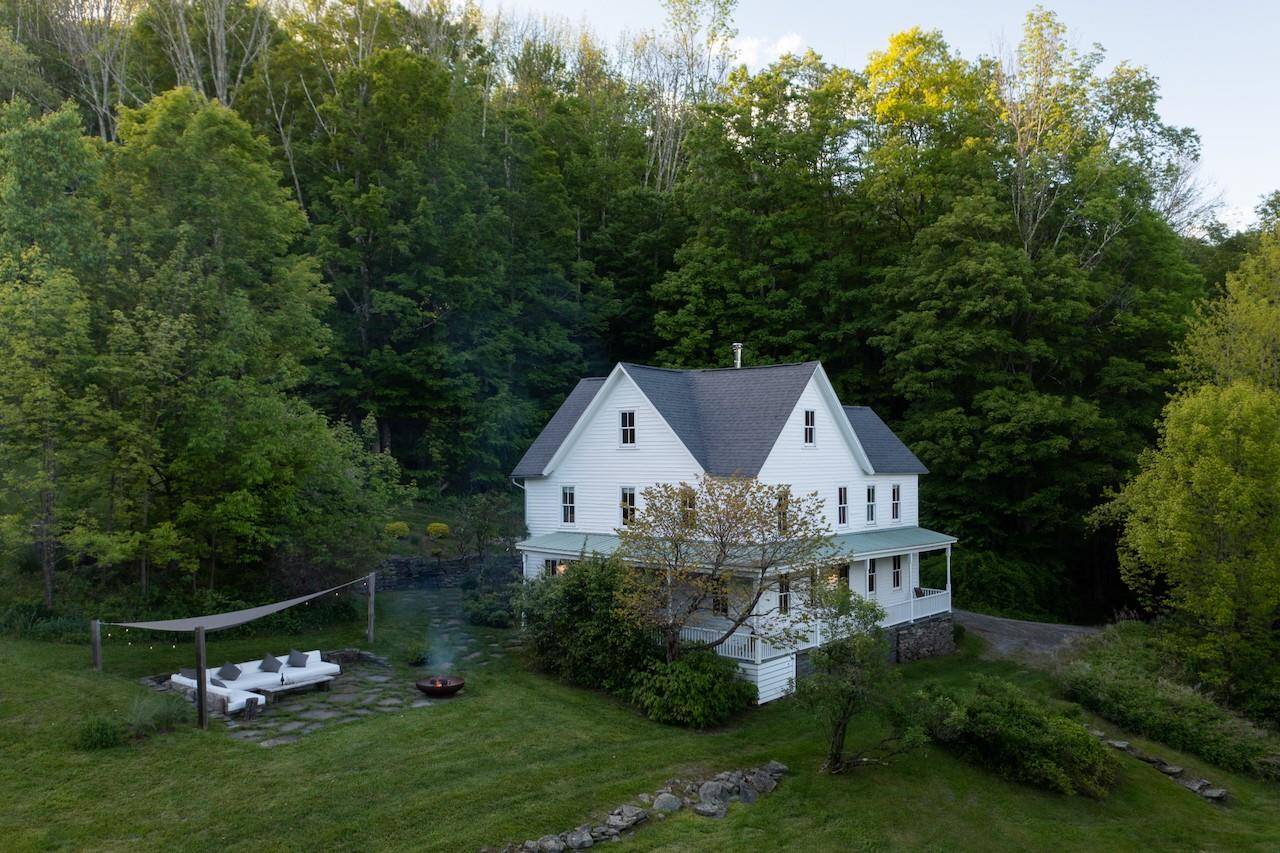 Tucked into a hidden hillside meadow of wild apple trees, this 1880s Catskills farmhouse feels like a well kept secret.