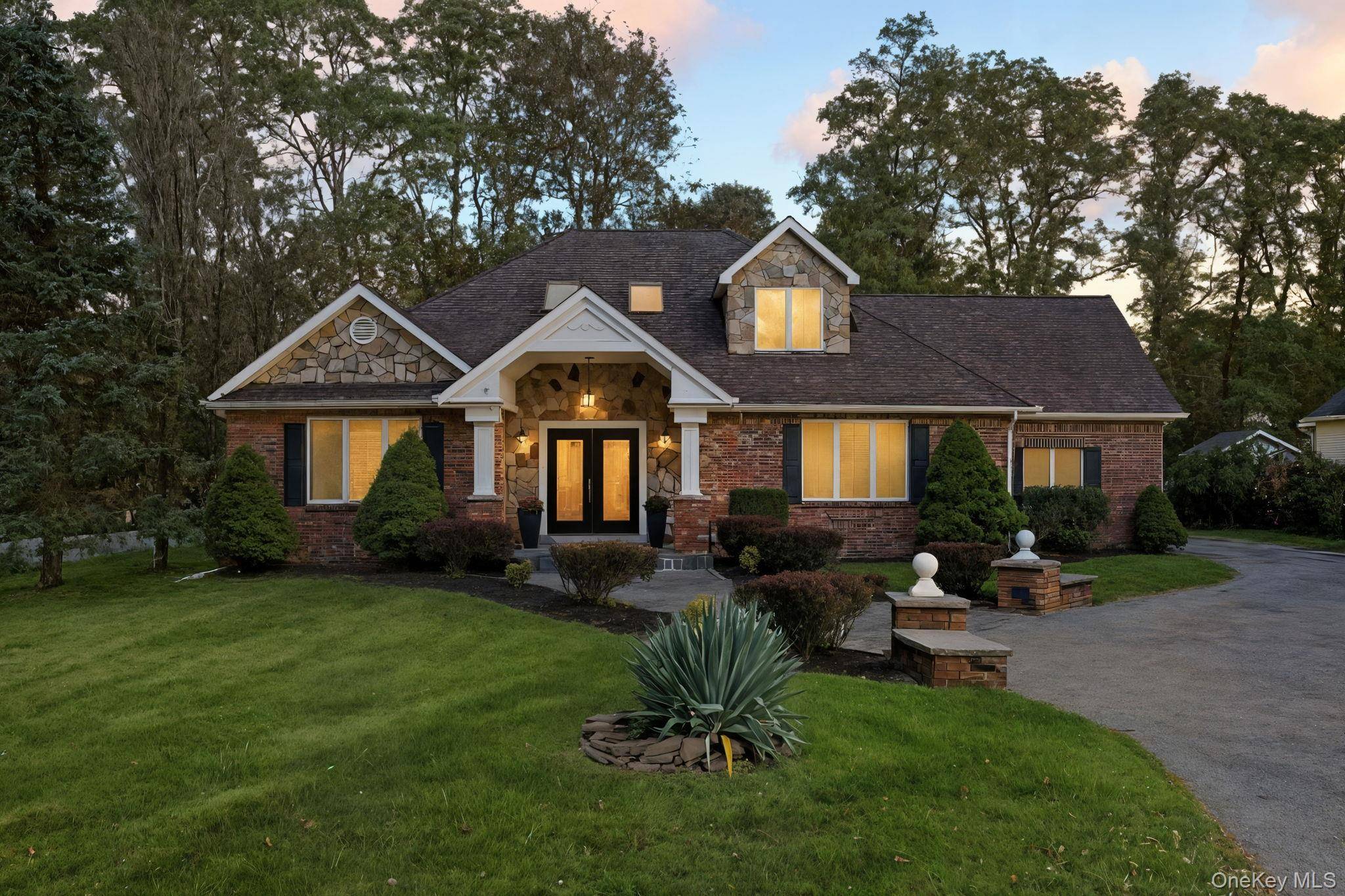 Welcome to 45 Evergreen Avenue, a stunning Brick Contemporary Colonial that seamlessly blends elegance and comfort !