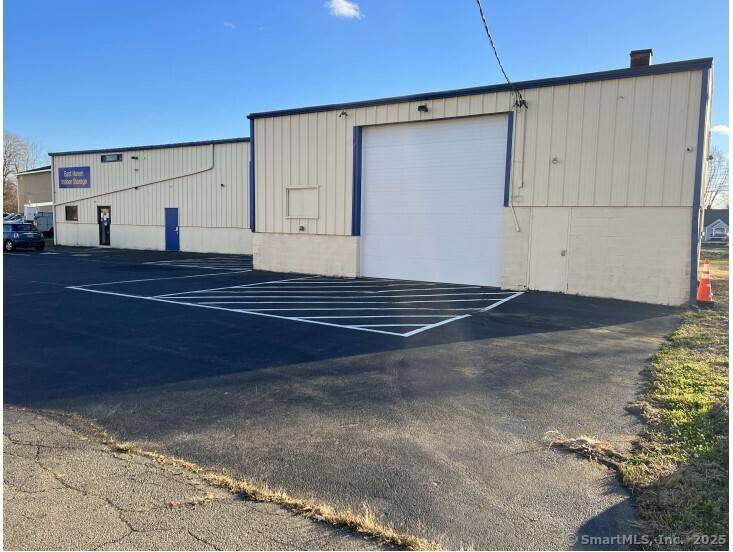 2. 665 Old Bradley Street in East Haven, Connecticut, is a commercial warehouse, currently serves as a Self Storage Facility, but can be converted.