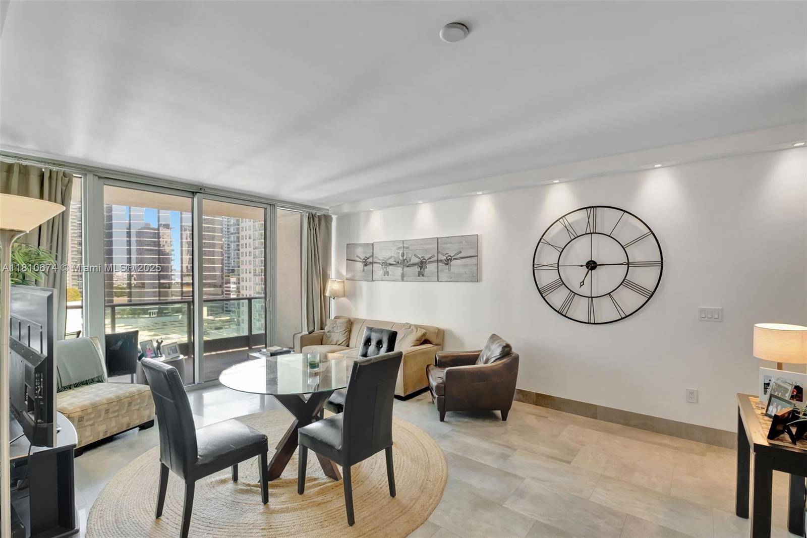 This sophisticated one bedroom residence features floor to ceiling and hurricane impact windows, high ceilings, Italian wood cabinetry, premium appliances, and abundant natural light.