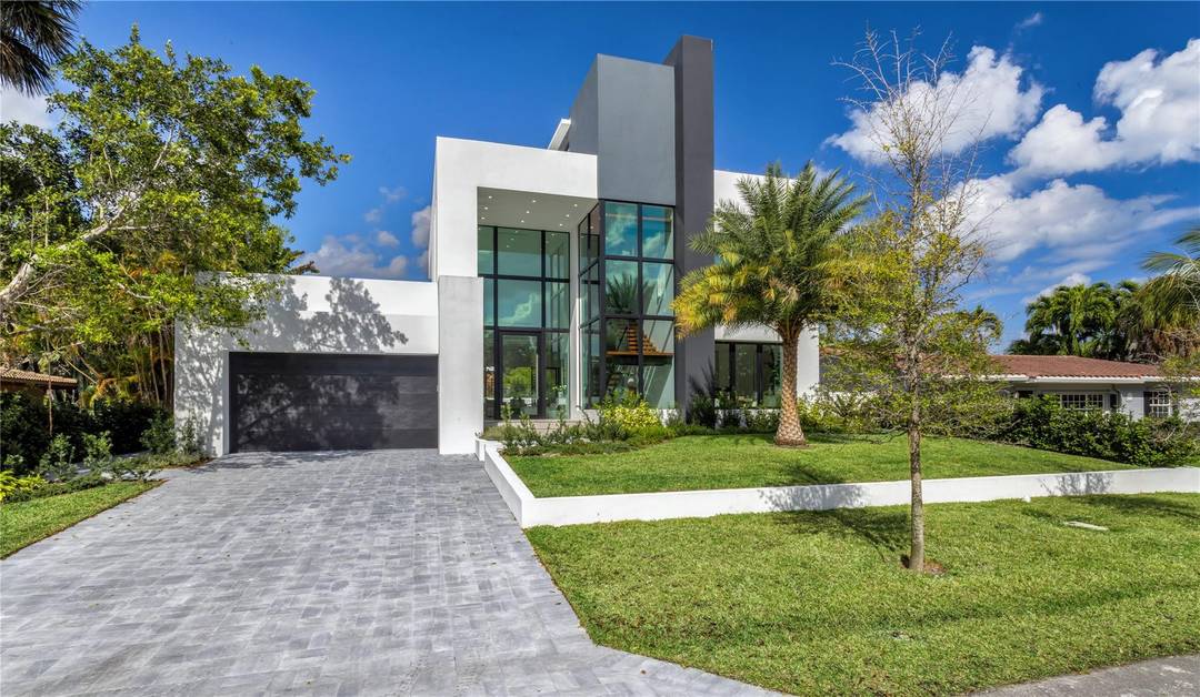 New Construction Modern Residence artfully crafted by Garza Contractors in the exclusive enclave of Hillsboro Shores with private beach access just a short stroll away.