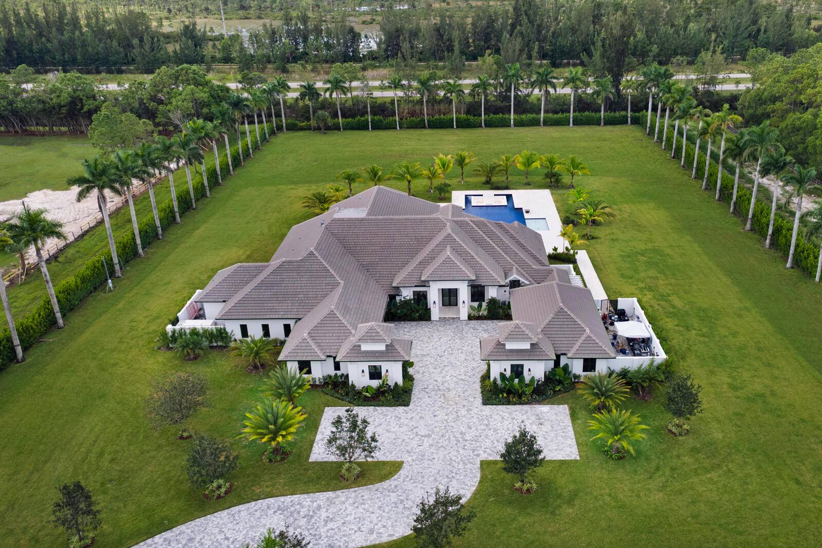 Welcome to this brand new estate in the coveted equestrian community of Caloosa.