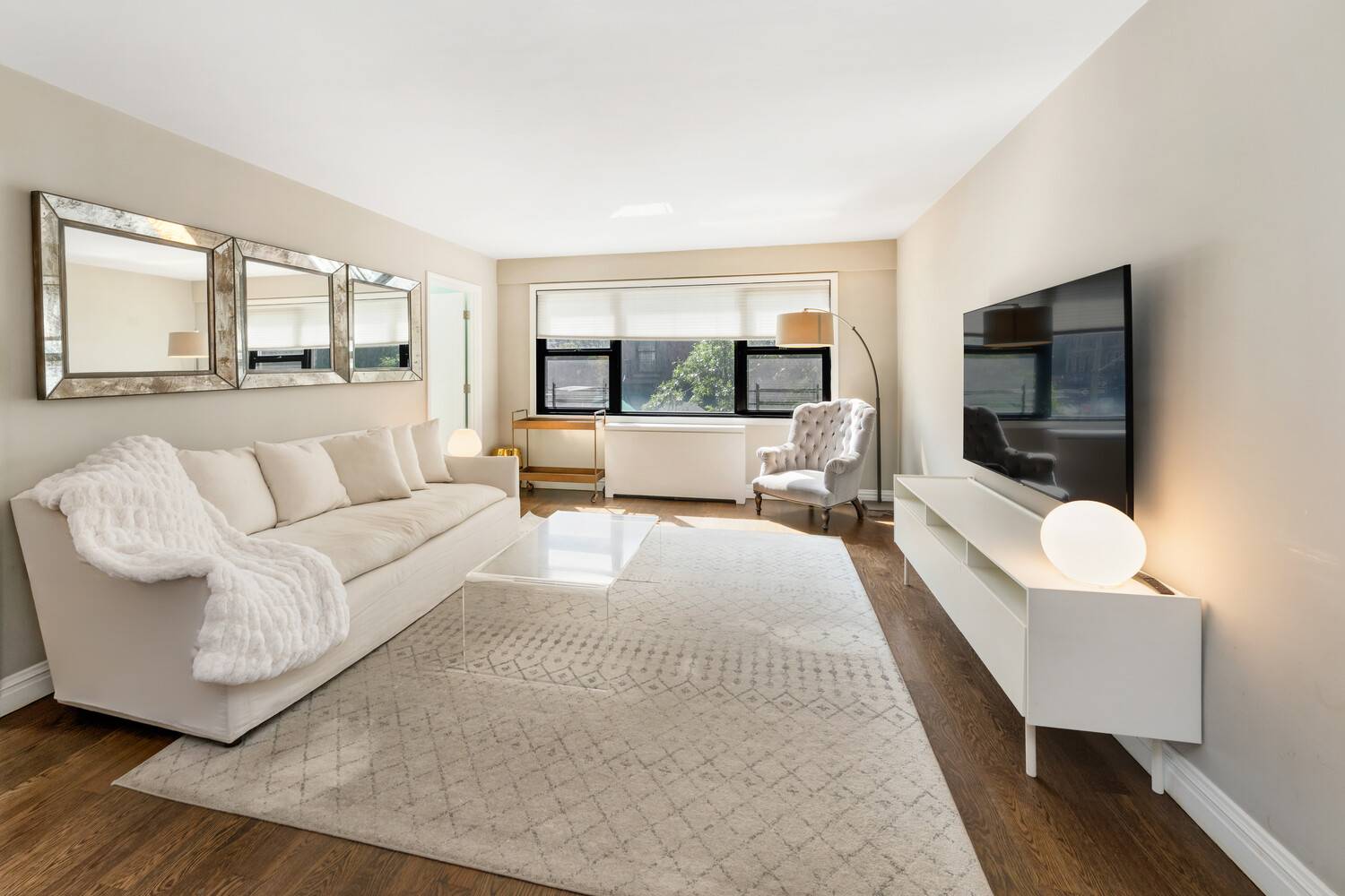 This beautifully maintained corner three bedroom, two bath cooperative welcomes you with a gracious entry foyer that immediately sets the tone for the home's scale and functionality.
