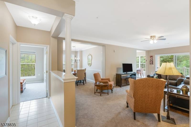 Welcome to this beautifully appointed 2nd level, elevator building end unit located in the highly sought after Renaissance at Raritan Valley, a premier active adult community designed for those seeking ...