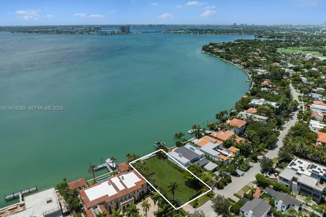 A rare opportunity to own a premier waterfront lot on prestigious North Bay Road, featuring 80 ft of water frontage, complete with approved plans, permits, and a newly built seawall.