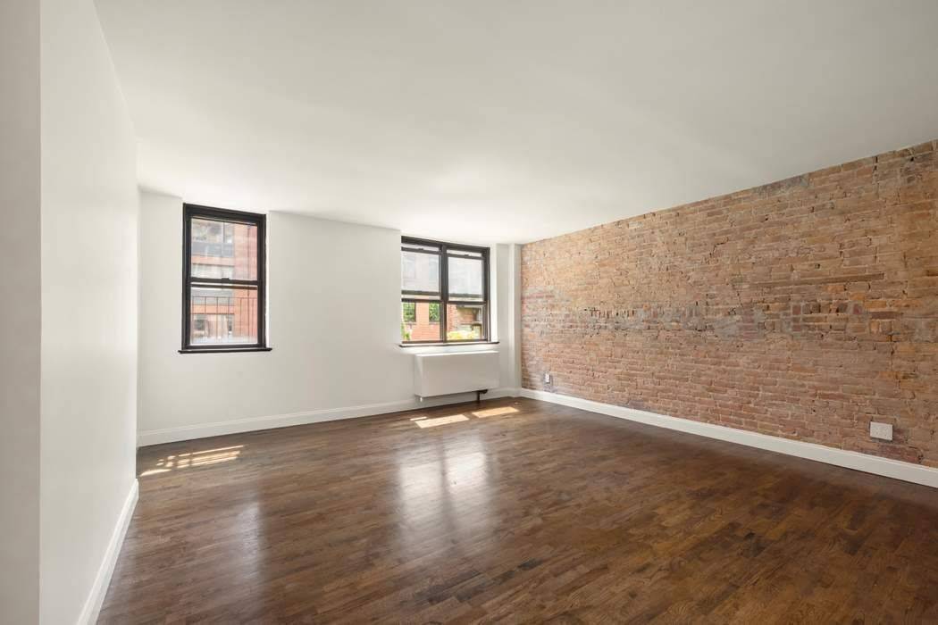 Turn key gut renovated super bright and airy loft like studio with beautifully refurbished hardwood floors, a custom designer kitchen with new stainless appliances with warranties.