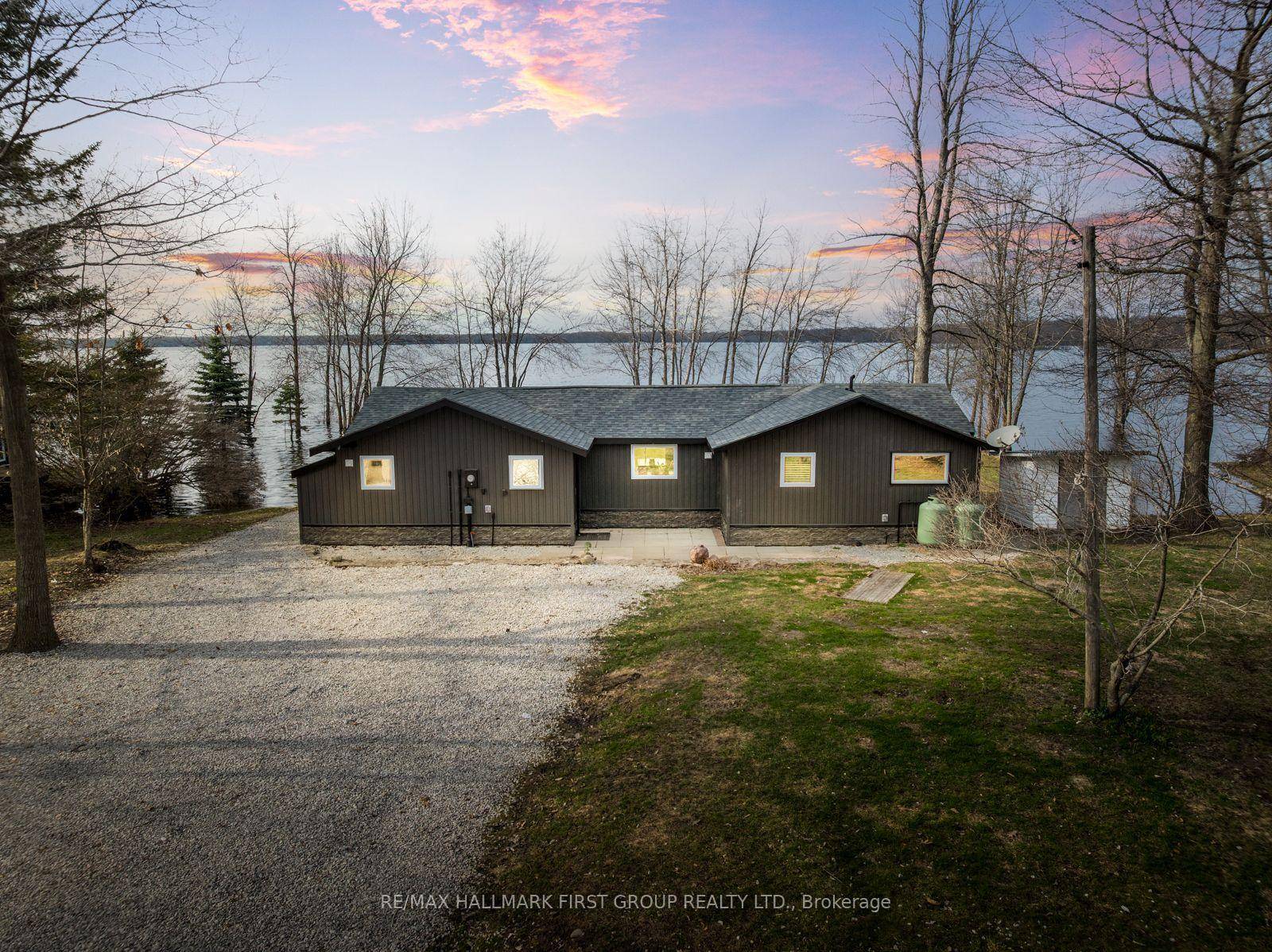 Welcome To This Fully Renovated 3 Bedroom Bungalow Offering 1, 361 Sq Ft Of Bright, Modern Living Space On A Large Lot With 123 Ft Of Prime Waterfront On Lake ...