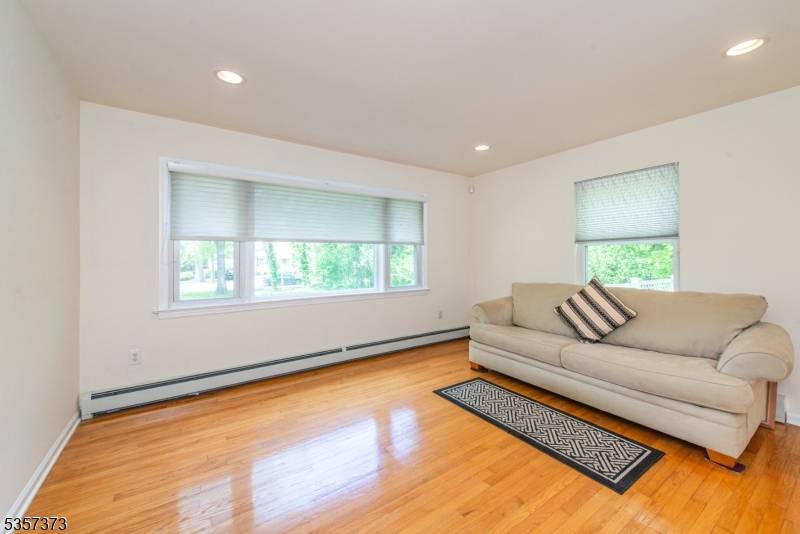 Welcome to this huge expanded split level in Roseland on a large parklike property !