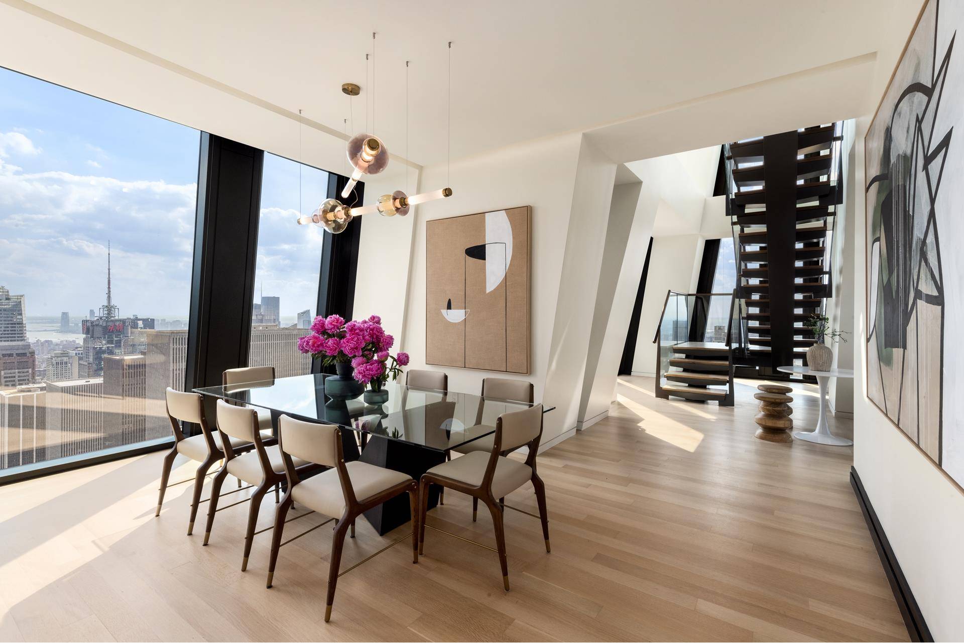 Duplex Residence 72B at 53 West 53 comprises 4, 216 square feet, offering three bedrooms, three and a half bathrooms, and south, north, east, and west facing exposures.