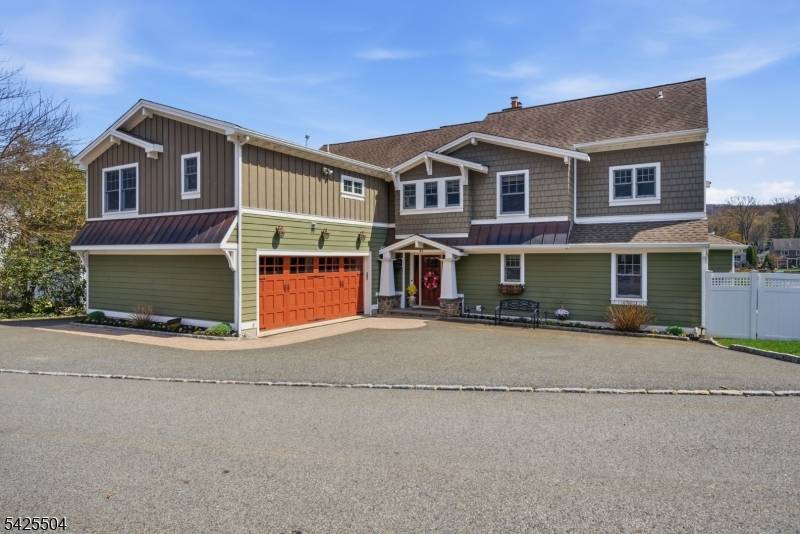 Absolutely stunning lakefront Craftsman style Colonial on one of the most desirable few double lots on Indian Lake, offering panoramic water views timeless design.