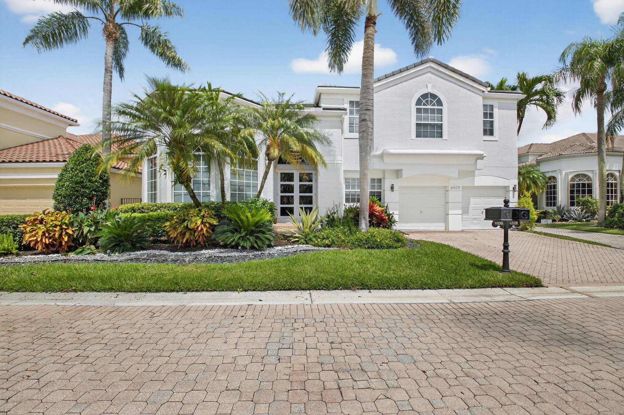 Welcome to this stunning, completely renovated residence in desirable Woodfield Country Club.