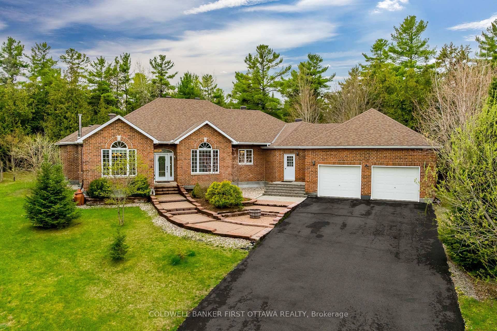 This exceptional all brick bungalow is nestled on almost 4 acres of beautifully treed, private land, offering the perfect balance of elegance, comfort, and space.