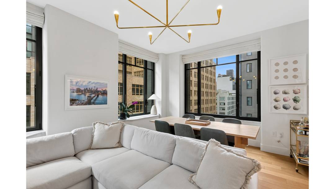 Residence 14D is a beautifully proportioned corner two bedroom, two bathroom condominium with north, west, and east exposures, offering exceptional natural light along with open city and Hudson River views.