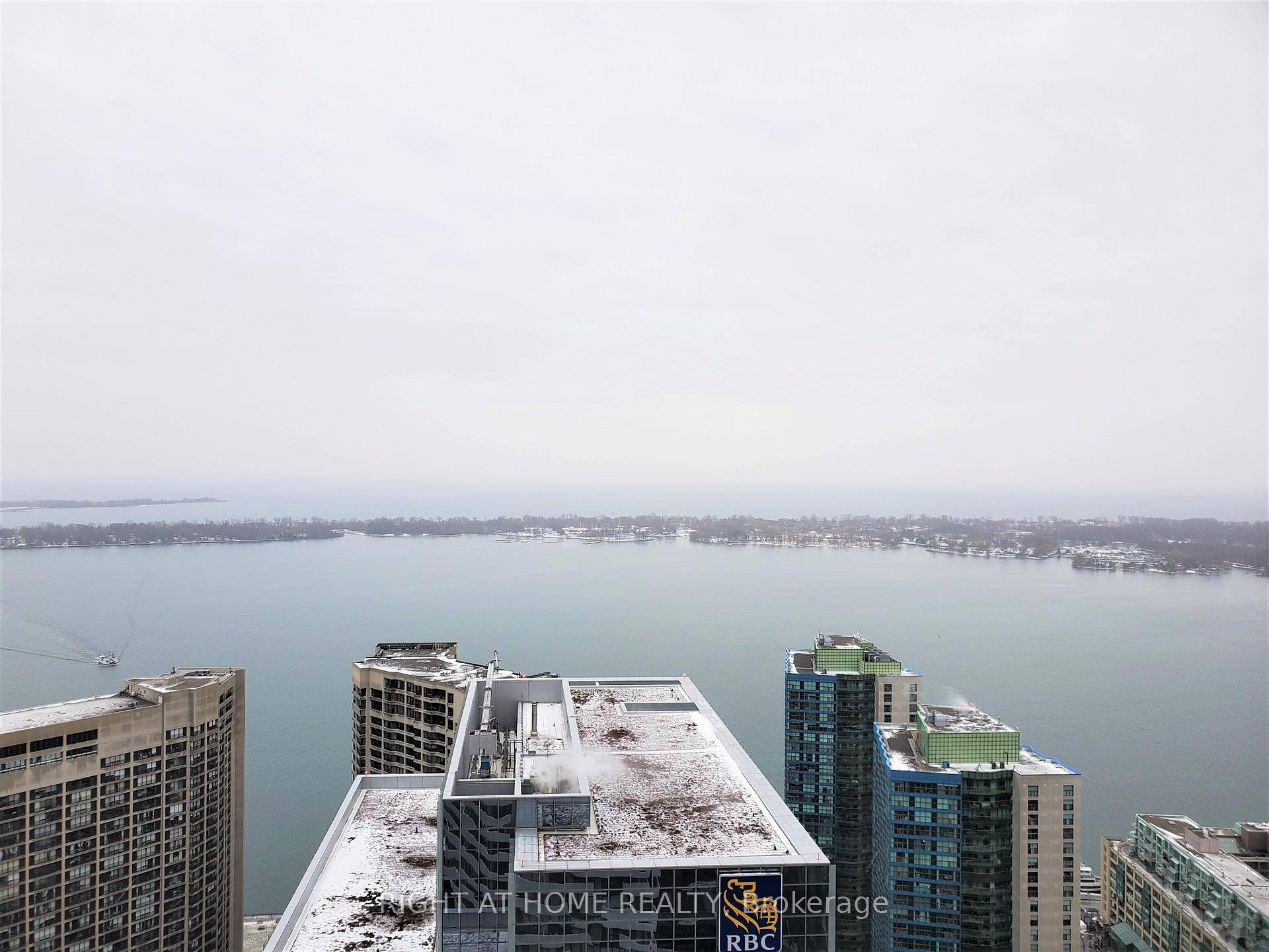 Sunlight Filled South Facing Unobstructed View Of The Lake On A Rare High Level.