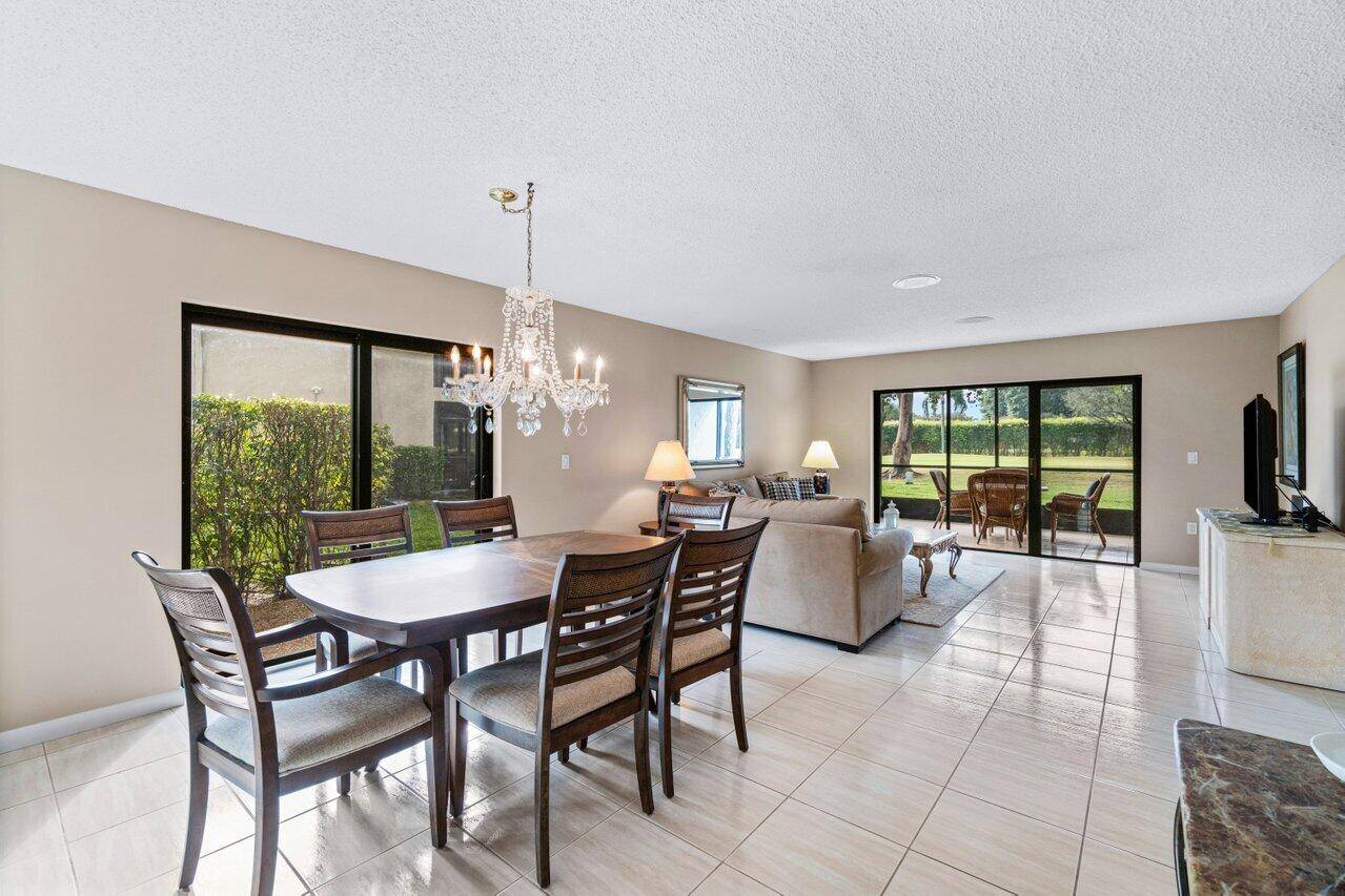 Turn key first floor corner condo in Stratford East at Hunters Run Country Club.