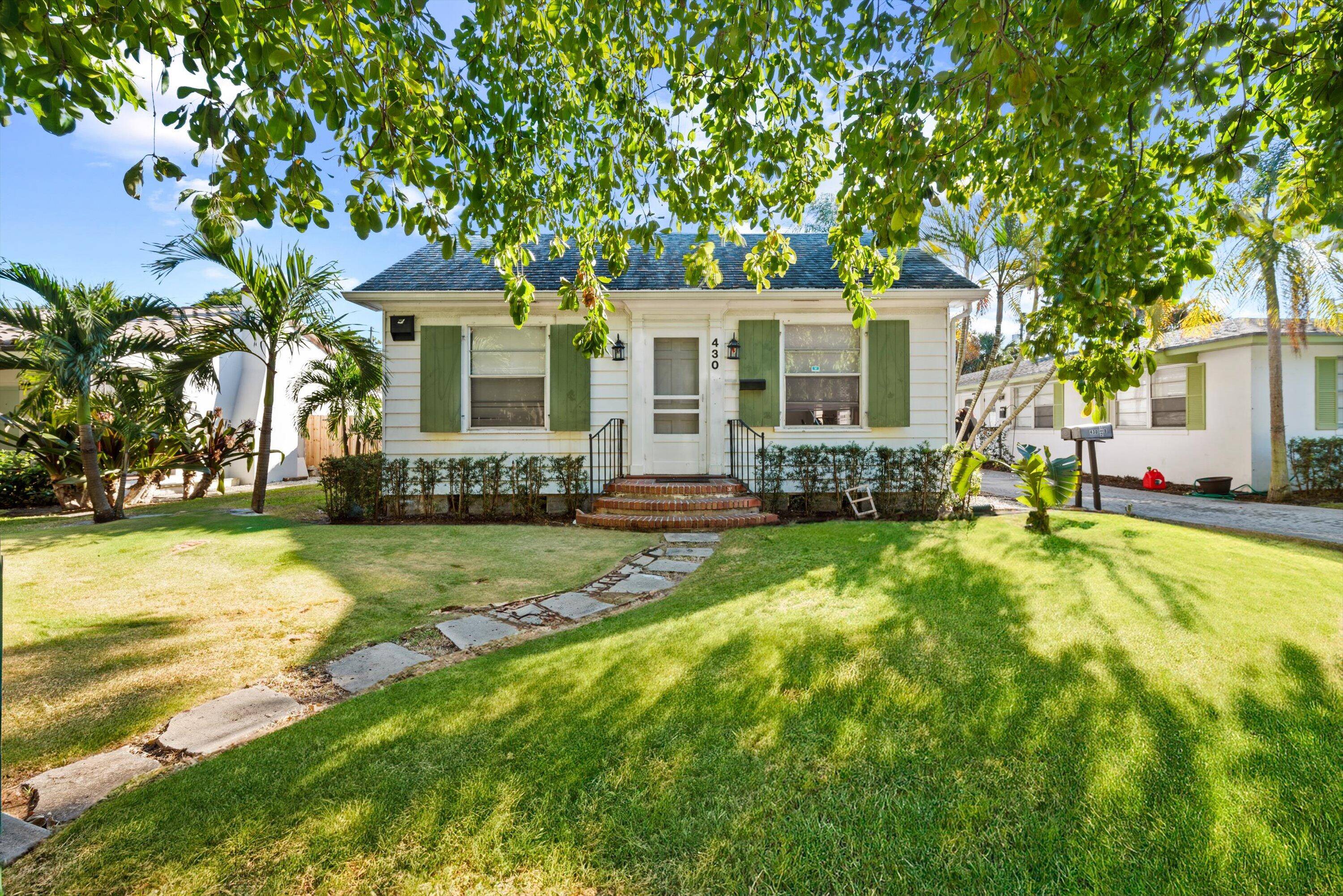 Wonderful opportunity to own an historic home home with TWO rental units in the rear !