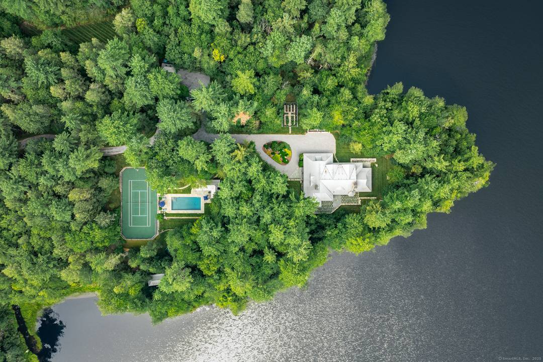 Gracefully nestled at water's edge among lofty pines on over 115 utterly private and unspoiled woodland acres, this breathtaking lakefront country home features five bedrooms and four and a half ...
