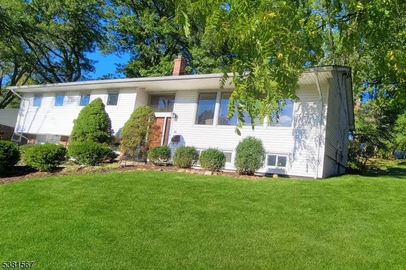 HALF ACRE in PRESTIGIOUS BROADLAWN with TONS of NATURAL LIGHT this CUSTOM BI LEVEL boasts 2600 sq ft of Living Space.