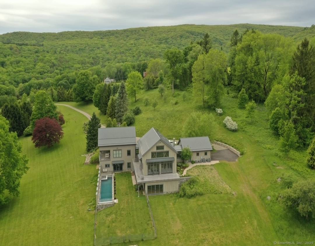 Architectural Mountain View Estate on 39 Acres and Infinity Pool Magnificent architectural gem showcases breathtaking Berkshire Mountain panoramas from nearly every room.