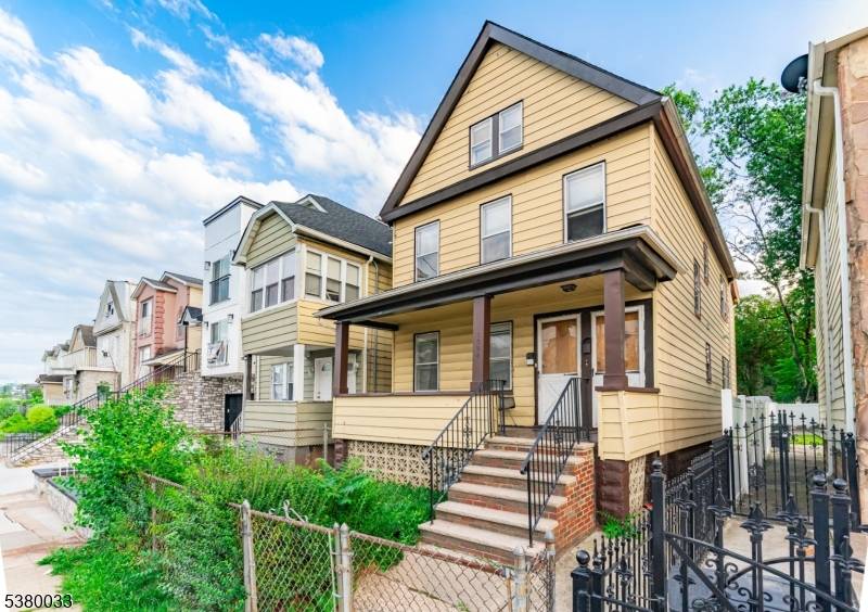 This two family home in Elizabeth, NJ offers great potential with its bright, natural light streaming through large, original style windows that give the space an open and welcoming feel.