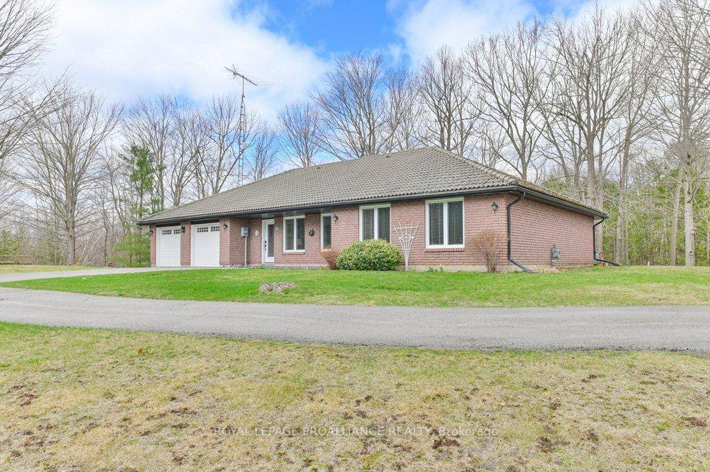 Welcome to 361 Crookston Road a stunning custom built bungalow nestled on a serene 3.