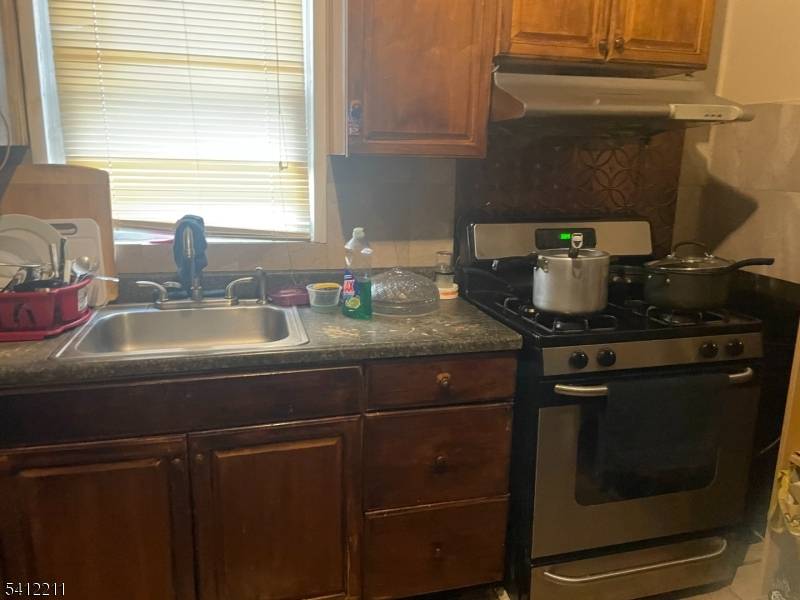 TWO FAMILY HOME WITH GARAGE AND DRIVEWAY, SECOND FLOOR HAS ALSO THE USE OF THE ATTIC EXTRA SPACE.