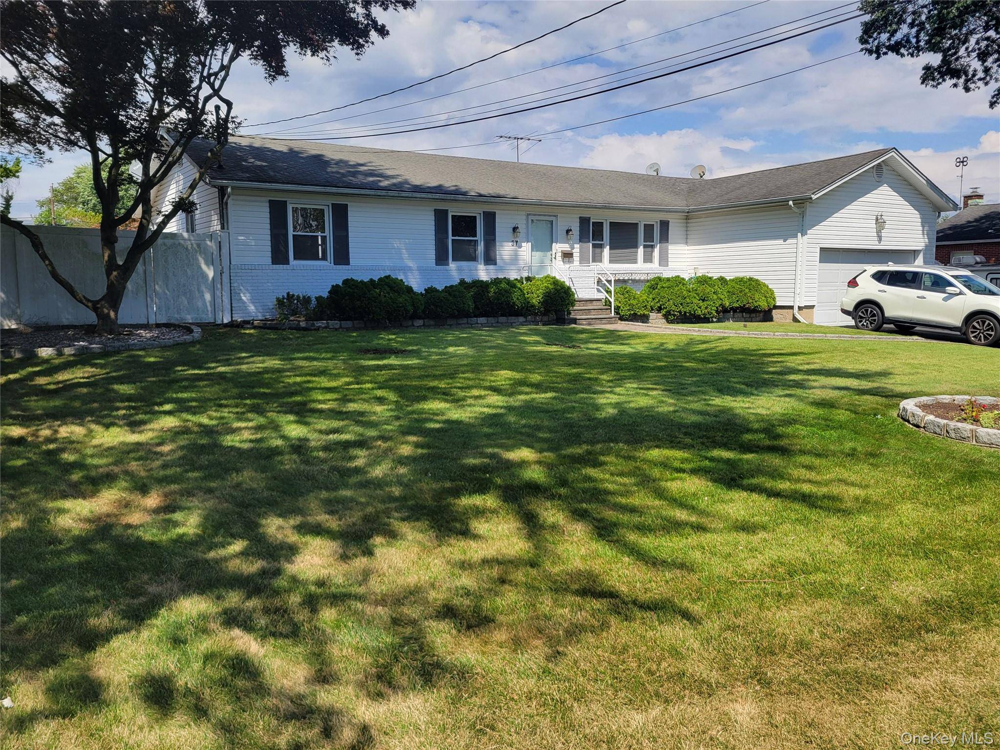 Charming and updated is this custom 3 bedroom Expanded Ranch.