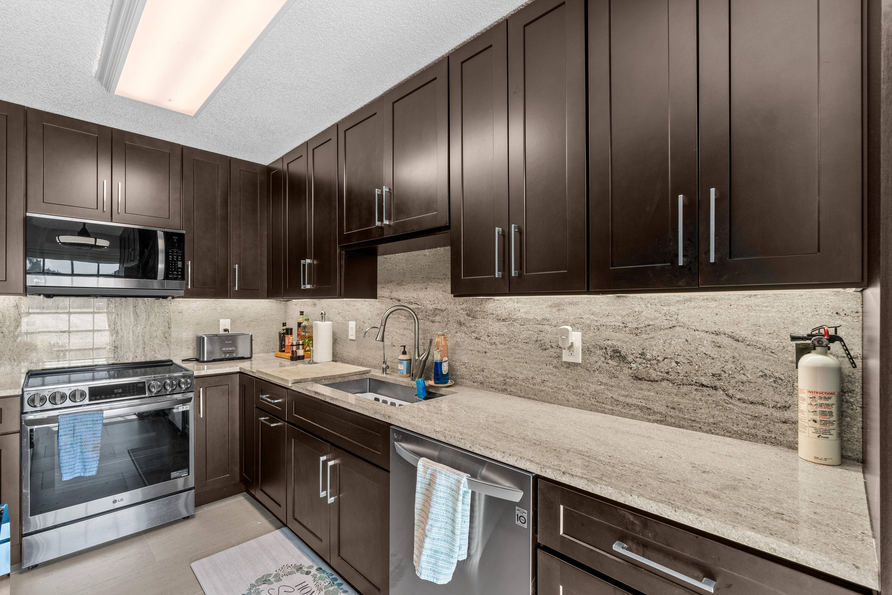 End unit villa with modern flair and unbeatable location !
