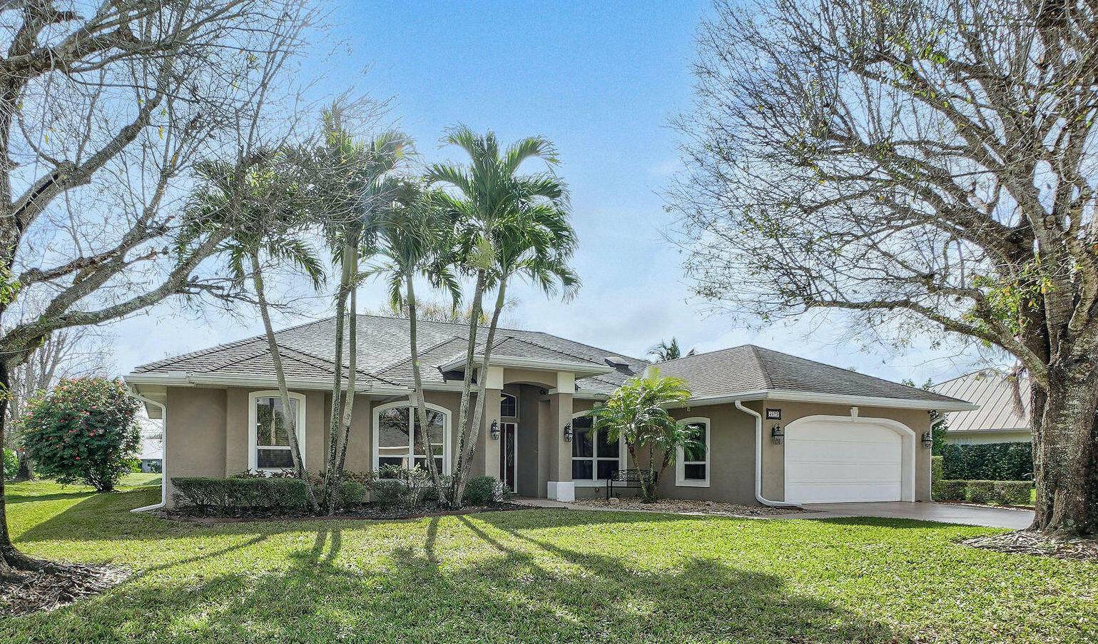 Welcome to 4073 SW Lakewood Dr, an exceptional residence nestled in the sought after gated community of Danforth in Palm City, FL.