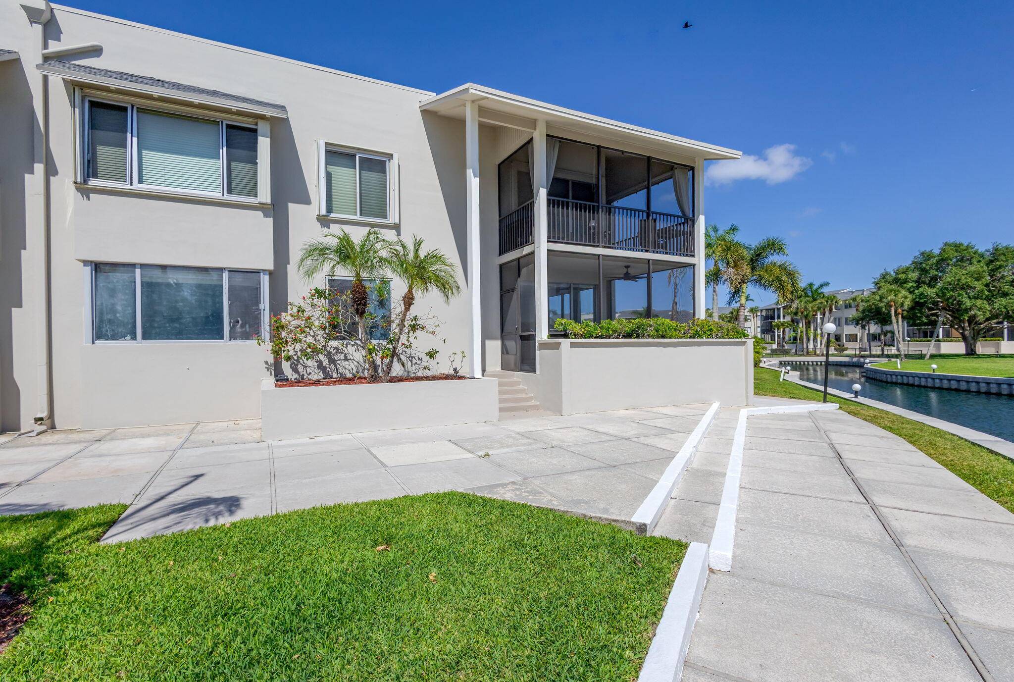 BEAUTIFULLY UPDATED FIRST FLOOR CORNER UNIT, PRIVATE IDEALLY LOCATED WITH SOME OF THE BEST VIEWS IN THE COMMUNITY.