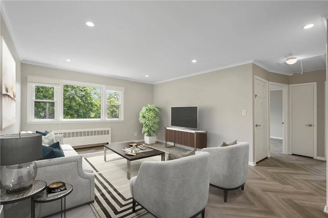 Discover the epitome of modern living in this meticulously renovated top floor unit located 2 blocks from Crestwood Metro North.