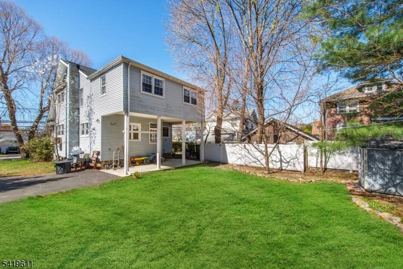Beautifully maintained classic colonial located on a tree lined street close to schools in the highly desirable FLATS section of Boonton.