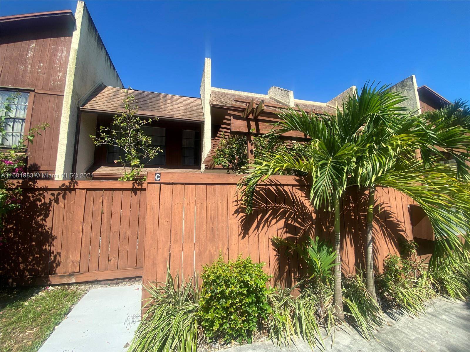Townhome located in the sought after, lush grounds in the gated community of Snapper Village.