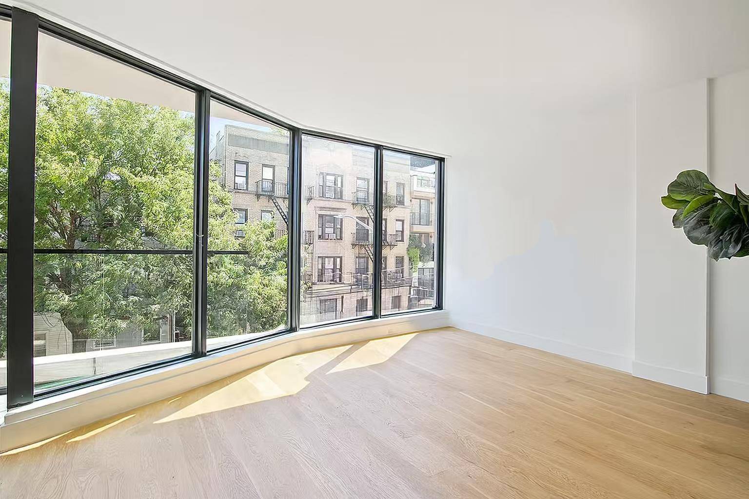 Residence 2 offers a generous 1159 SF of open plan living space with 2 beds, 2 baths, and two balconies.