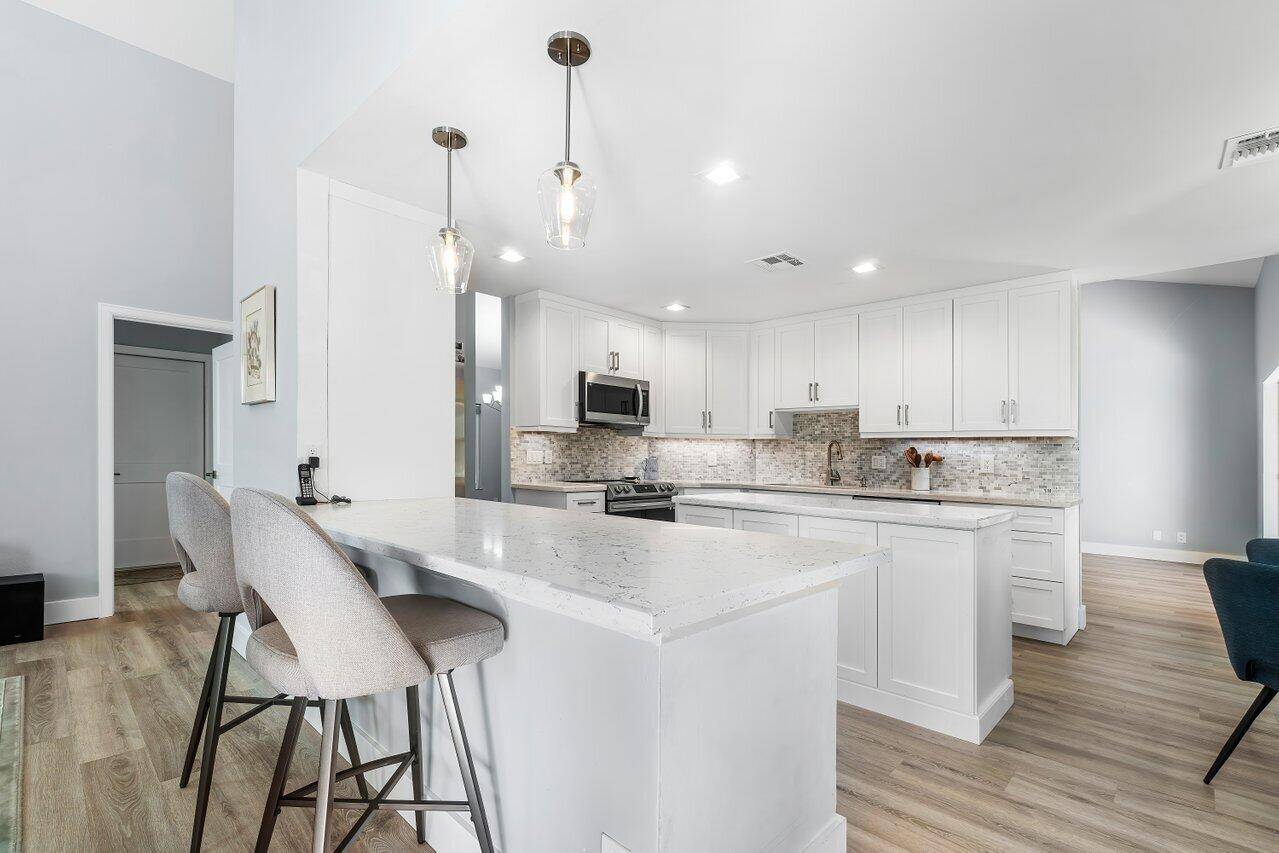 Welcome to 723 Golf Court, a newly renovated home on one of the BEST LOTS in quiet Fairways of Delray with room for a pool !