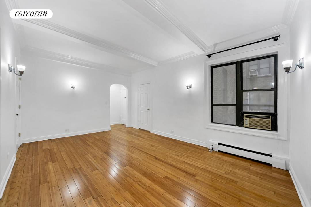 Welcome to 120 West 58th Street, Unit 2C, a charming pre war condo nestled in the Central Park South area, right off glorious Central Park.