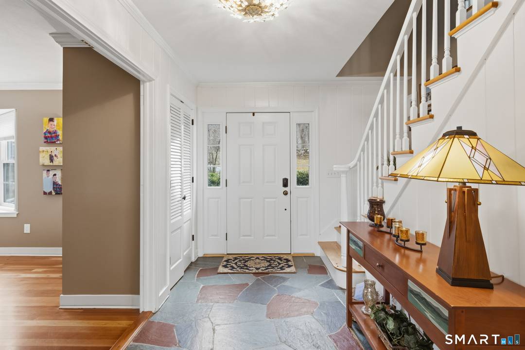 Set high above the Farmington Valley on one of Simsbury's most elevated spots, this updated Colonial showcases sweeping, unobstructed views to Massachusetts a breathtaking backdrop for everyday living.