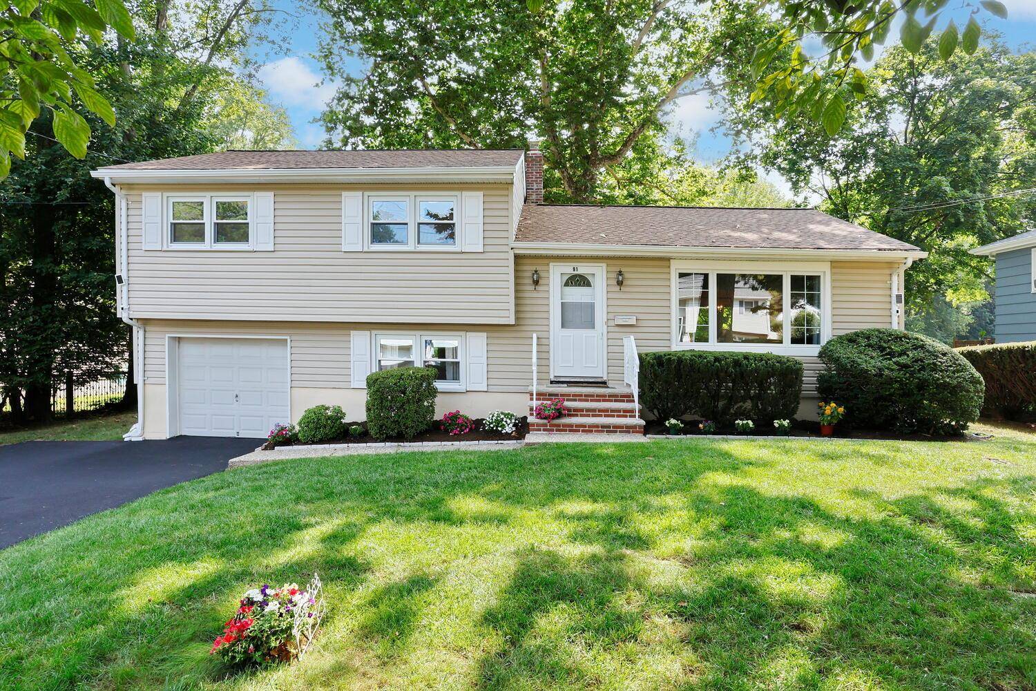 Well maintained and lovingly cared for Split level on magnificent fenced in park like approx.